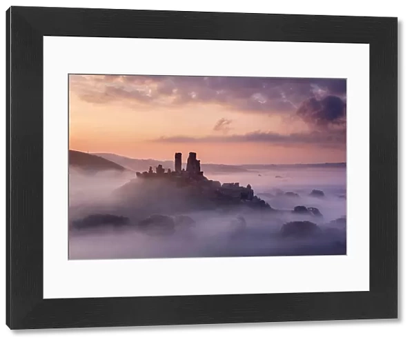 Corfe Castle, early morning llight and mist, Corfe Castle, Dorset, UK. September 2014