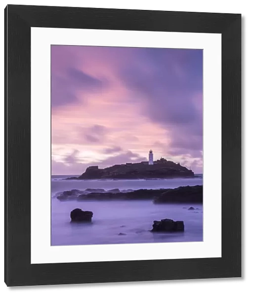 Godrevy Lighthouse at dusk, St. Ives Bay, West Cornwall, England, UK. February 2016