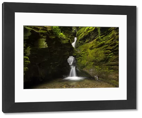 Merlins Well waterfall at St Nectans Glen, near Tintagel, North Cornwall, UK