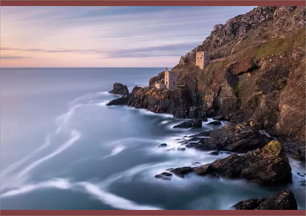 The Crowns Engine Houses at Botallack, high tide at sunset, West Cornwall, UK