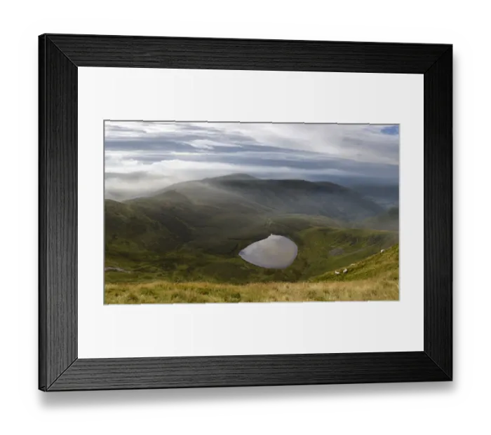 Framed Print : Vew of Llyn Lluncaws taken from Moel Sych in the Berwyn Mountains, Powys, Wales, UK August Framed Print : Vew of Llyn Lluncaws taken from Moel Sych in the Berwyn Mountains, Powys, Wales, UK August