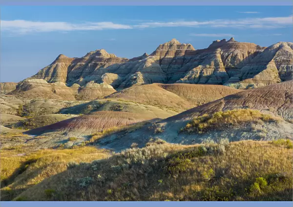 Late afternoon light warms the colors in the Yellow Mounds area, Badlands National Park