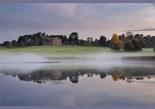 Berrington Hall reflected in lake at dawn, Herefordshire, England, UK, October 2015