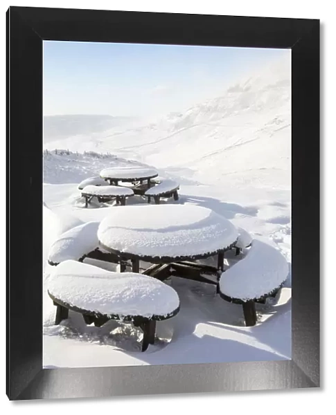 Picnic tables on the summit of Kirkstone Pass, plastered in fresh snow after overnight