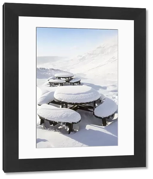 Picnic tables on the summit of Kirkstone Pass, plastered in fresh snow after overnight