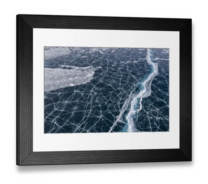 Framed Print : Transparent black ice with cracks on Lake Baikal, aerial shot Framed Print : Transparent black ice with cracks on Lake Baikal, aerial shot