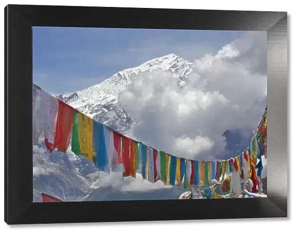 Prayer flags and mountain landscape, Mt Qomolangma National Park, Qinghai Tibet Plateau, China
