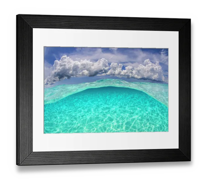 Framed Print : Light patterns on the seabed and fluffy cumulus clouds in the sky in a split level image. North Sound, Grand Cayman, Cayman Islands, British West Indies. Caribbean Sea Framed Print : Light patterns on the seabed and fluffy cumulus clouds in the sky in a split level image. North Sound, Grand Cayman, Cayman Islands, British West Indies. Caribbean Sea