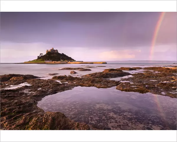 St Michaels Mount at sunrise with a rainbow over Penzance, Marazion, Wesat Cornwall