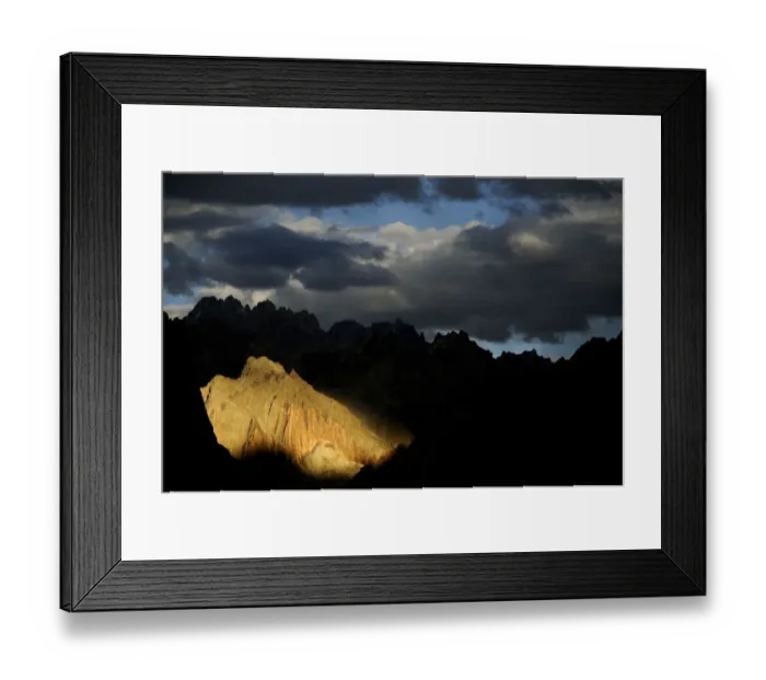 Framed Print : Mountain peaks and ridges in evening light, stormy skies above Framed Print : Mountain peaks and ridges in evening light, stormy skies above