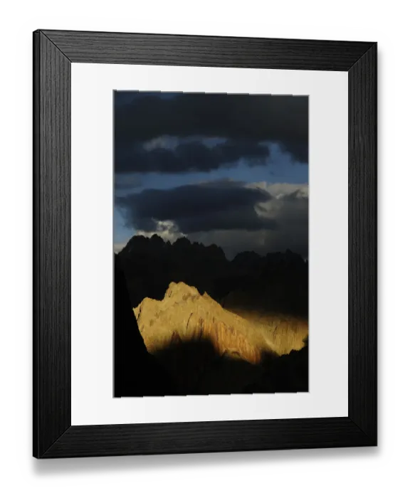 Framed Print : Mountain peaks and ridges in evening light, stormy skies above Framed Print : Mountain peaks and ridges in evening light, stormy skies above
