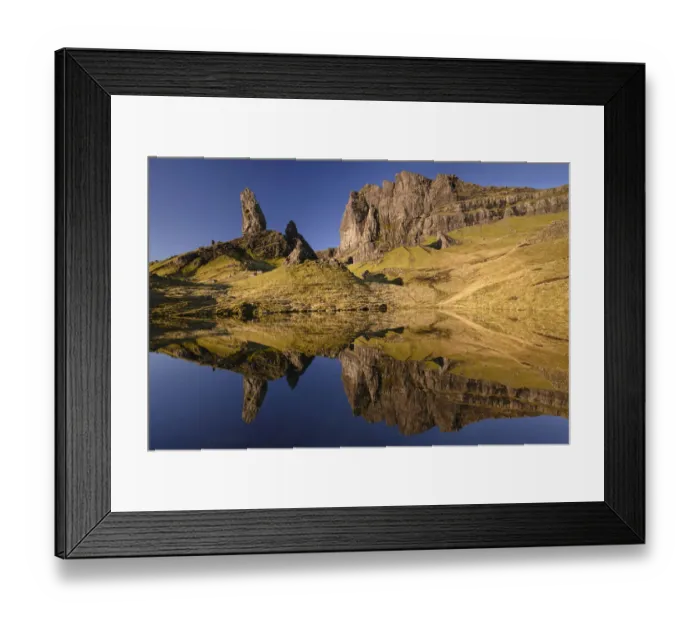 Framed Print : Old Man of Storr reflected in small lochan in morning light Framed Print : Old Man of Storr reflected in small lochan in morning light