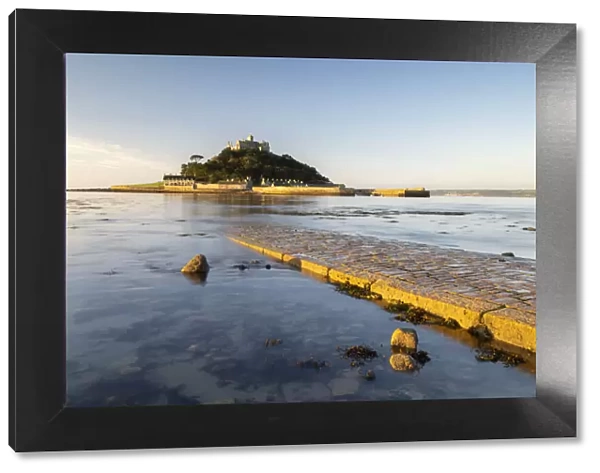 St Michaels Mount in morning light, cobbled causeway underwater at high tide