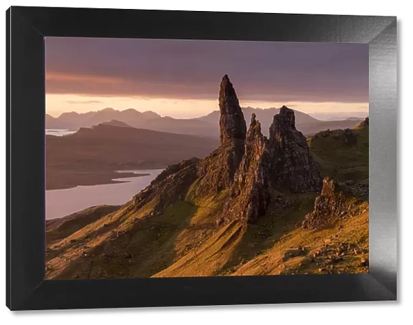 RF - The Old Man of Storr at sunrise, view down to Loch Leathan and mountains. Isle of Skye, Inner Hebrides, Scotland, UK. November 2017. (This image may be licensed either as rights managed or royalty free. )