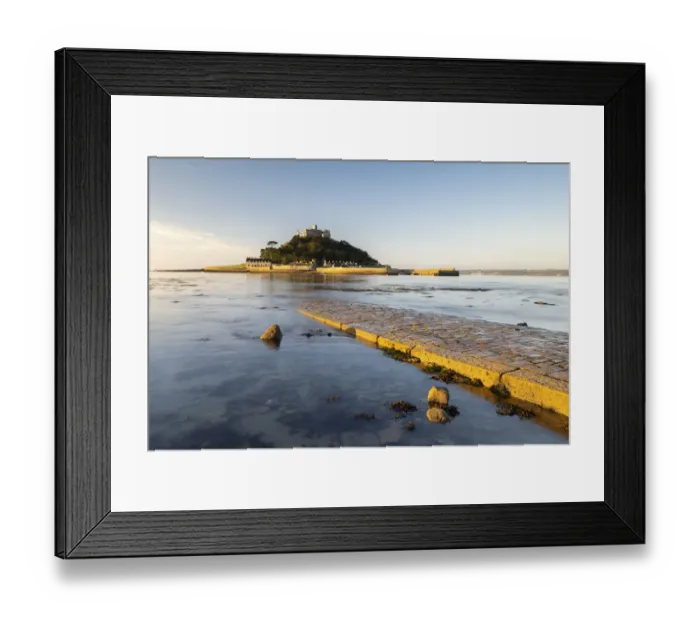 Framed Print : St Michaels Mount in morning light, cobbled causeway underwater at high tide Framed Print : St Michaels Mount in morning light, cobbled causeway underwater at high tide
