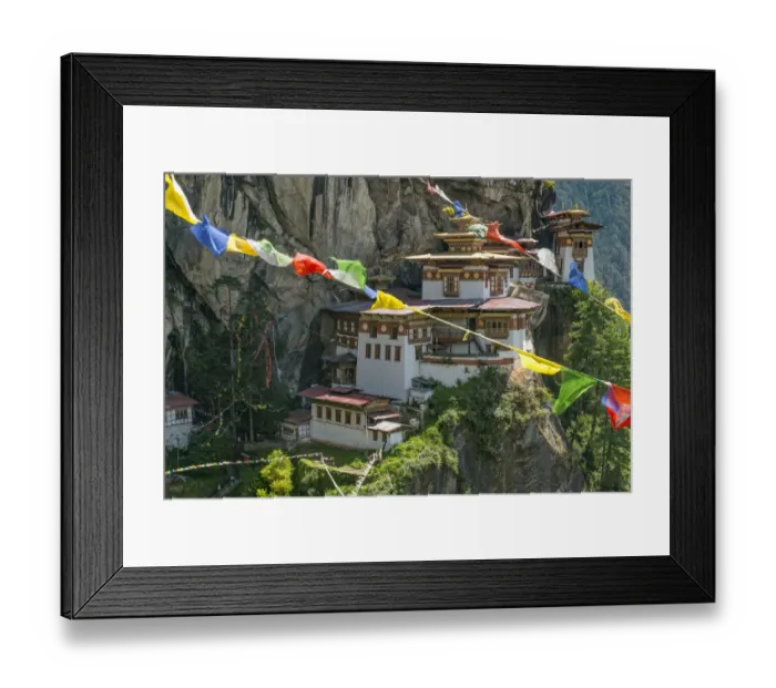 Framed Print : Paro Taktsang / Tigers Nest Buddhist monastery perched on cliffs with prayer flags Framed Print : Paro Taktsang / Tigers Nest Buddhist monastery perched on cliffs with prayer flags
