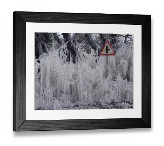 Framed Print : Road covered in icicles from splashed flood water, Hertfordshire, England, UK, February