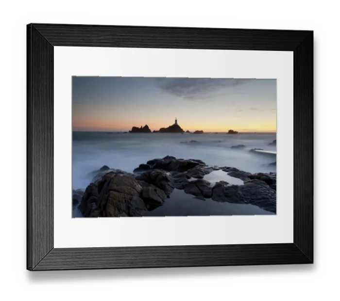Framed Print : Sunset views of La Corbiere lighthouse located at the extreme south-western point of Framed Print : Sunset views of La Corbiere lighthouse located at the extreme south-western point of