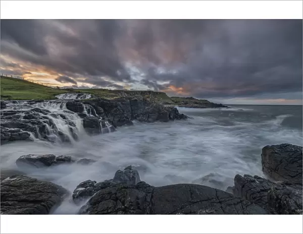 Feigh Burn River, Dunseverick Falls flowing into the sea, County Antrim