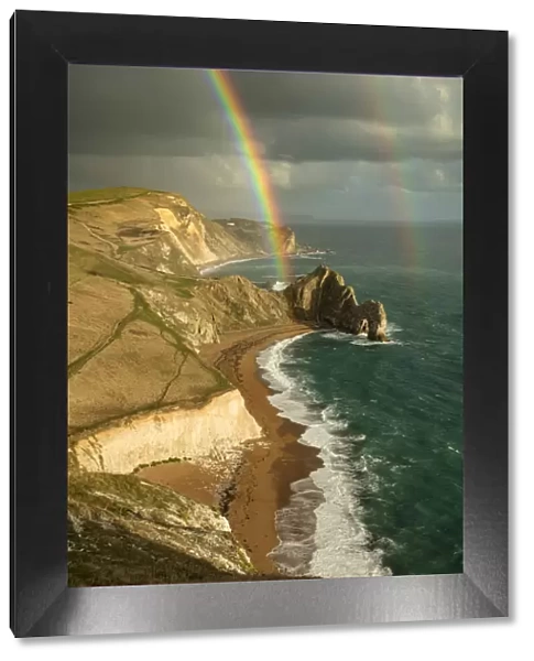 Rainbow over Durdle Door and the Jurassic Coast, Dorset, England, UK. October 2019
