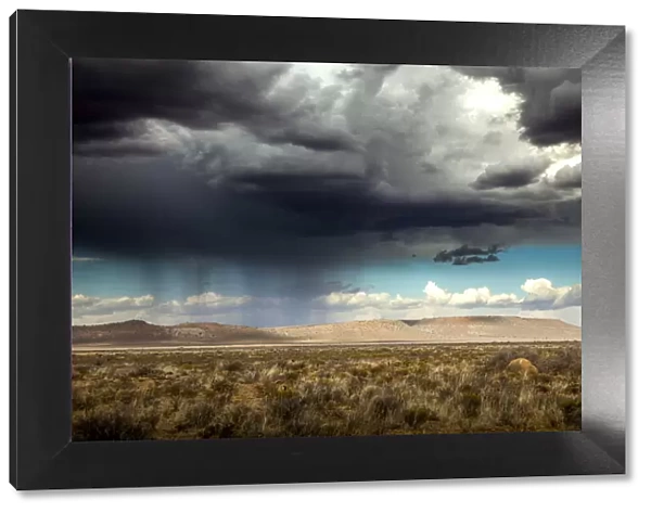 Rain and storm clouds passing over the desert, Karoo, South Africa, 2016