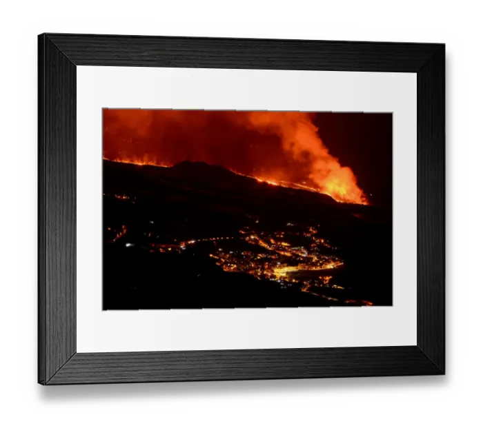Framed Print : Lava flow and ash from erupting volcano passing close by the village of Los Llanos de Aridane, Volcano Cumbre en Vieja, La Palma, Canary Islands. November, 2021 Framed Print : Lava flow and ash from erupting volcano passing close by the village of Los Llanos de Aridane, Volcano Cumbre en Vieja, La Palma, Canary Islands. November, 2021