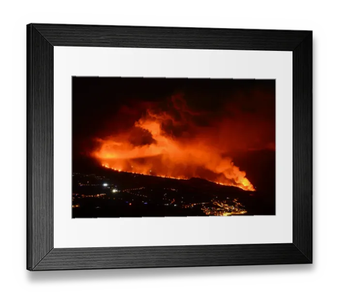 Framed Print : Lava flow and ash from erupting volcano passing close by the village of Los Llanos de Aridane, Volcano Cumbre en Vieja, La Palma, Canary Islands. November, 2021