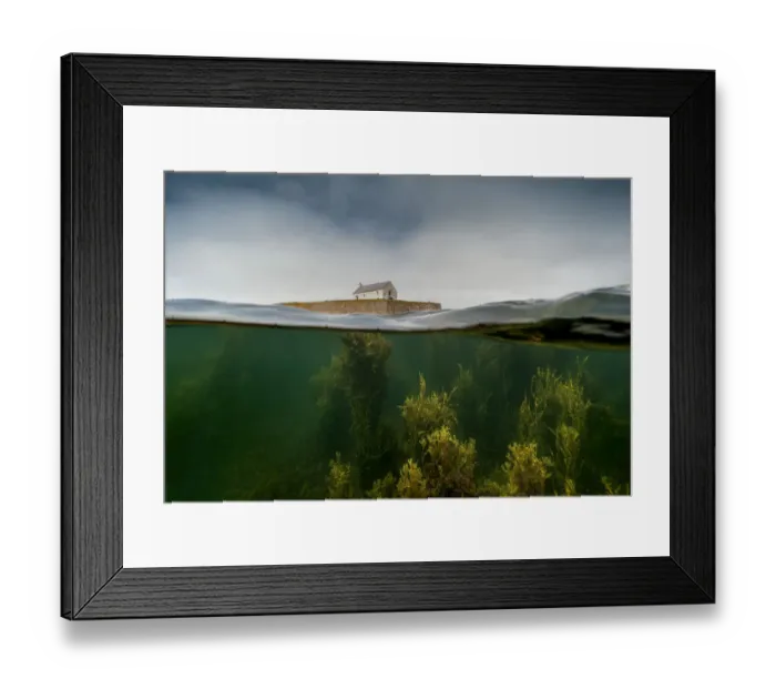 Framed Print : Split level image of the tiny chapel of St Cwyfan, surrounded by sea at high tide and underwater forests of mixed seaweed near Aberffraw, Anglesey, Wales, Irish Sea, UK. July Framed Print : Split level image of the tiny chapel of St Cwyfan, surrounded by sea at high tide and underwater forests of mixed seaweed near Aberffraw, Anglesey, Wales, Irish Sea, UK. July