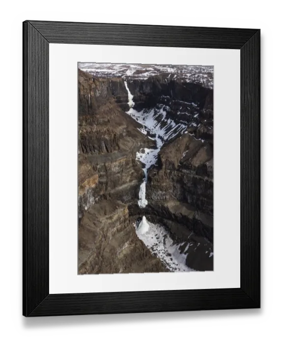 Framed Print : Aerial view of frozen waterfalls in deep canyon in plateau, Putoransky State Nature Reserve, Putorana Plateau, Siberia, Russia. May, 2021 Framed Print : Aerial view of frozen waterfalls in deep canyon in plateau, Putoransky State Nature Reserve, Putorana Plateau, Siberia, Russia. May, 2021
