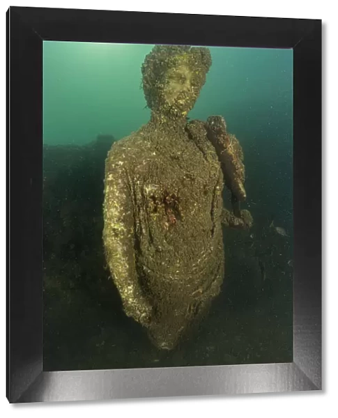 Ancient Roman statue of Antonia minor, member of Julio-Claudian dynasty, daughter of Marcus Anthony and sister of emperor Augustus, located in submerged Nymphaeum of Emperor Claudius. Marine Protected Area of Baia, Naples, Italy. Tyrrhenian sea