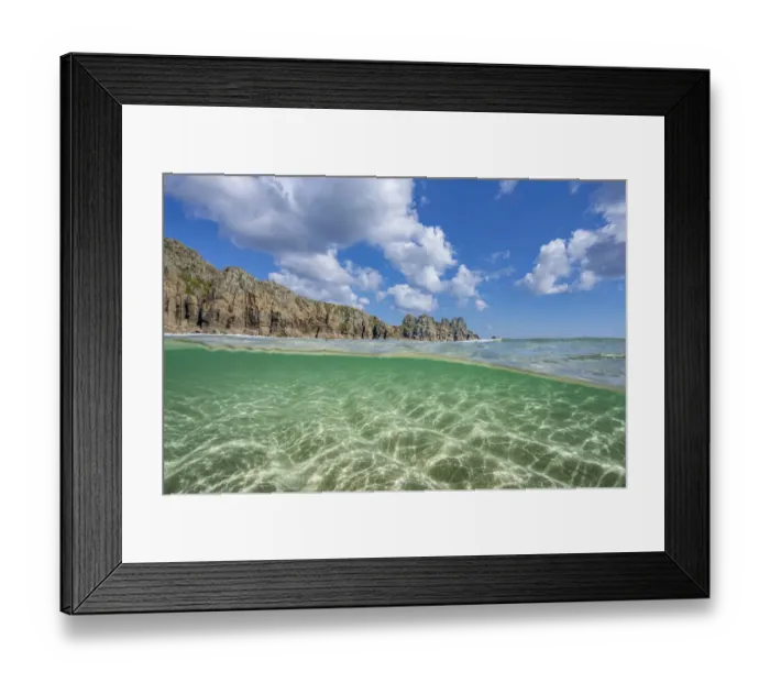 Framed Print : Split-level view of Logan Rock and coastline along Pedn Vounder beach, Cornwall, UK. May, 2021 Framed Print : Split-level view of Logan Rock and coastline along Pedn Vounder beach, Cornwall, UK. May, 2021