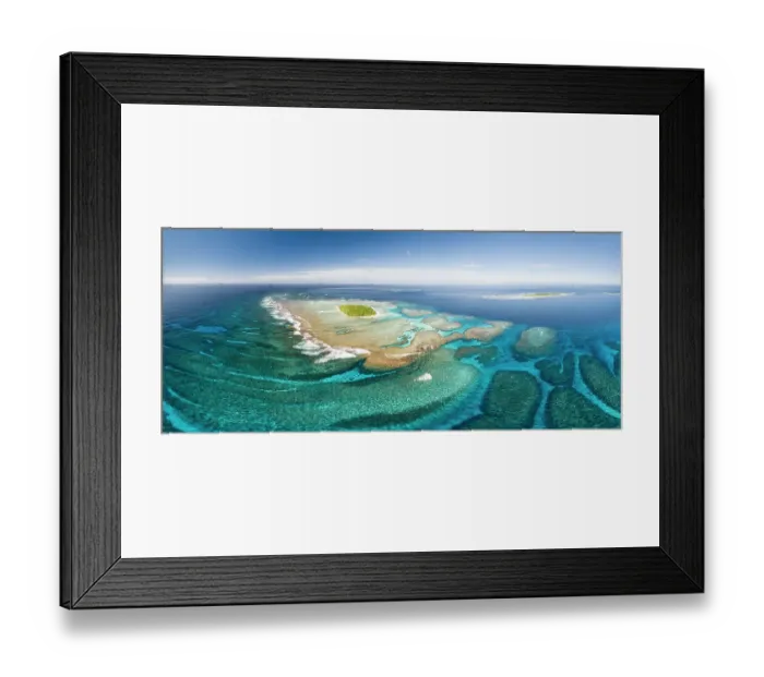 Framed Print : Aerial panorama of Maninita Island which sits atop an extensive coral reef structure, which is for the most part not visible from the surface of the ocean. Visible to the right behind Maninita is Taula Island