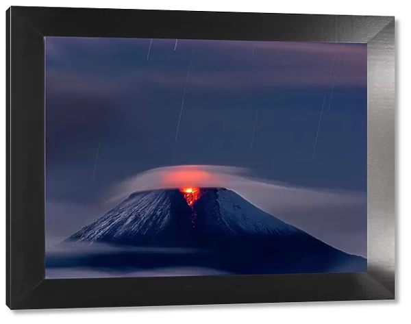 Sangay volcano erupting at night covered in low cloud,   Sangay National Park, Morona Santiago, Ecuador.   June, 2020