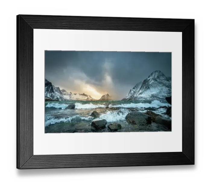 Framed Print : Winter storm clouds gathering along rocky shore surrounded by snow-covered mountains, Lofoten Island, Norway. March, 2023 Framed Print : Winter storm clouds gathering along rocky shore surrounded by snow-covered mountains, Lofoten Island, Norway. March, 2023