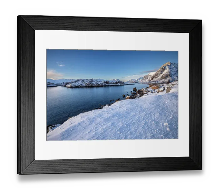 Framed Print : Snow over shore and mountains in winter, Henningvaer, Lofoten Islands, Norway. March, 2023 Framed Print : Snow over shore and mountains in winter, Henningvaer, Lofoten Islands, Norway. March, 2023