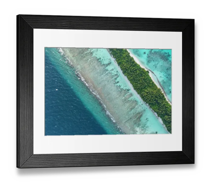 Framed Print : Aerial view of narrow coral atoll island with palm trees and white sand beach surrounded by reef, Dhigurah Island, South Ari Atoll, Maldives, Indian Ocean. February, 2020 Framed Print : Aerial view of narrow coral atoll island with palm trees and white sand beach surrounded by reef, Dhigurah Island, South Ari Atoll, Maldives, Indian Ocean. February, 2020