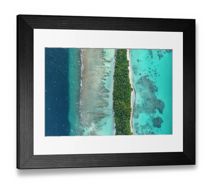 Framed Print : Aerial view of narrow coral atoll island with palm trees and white sand beach surrounded by reef, Dhigurah Island, South Ari Atoll, Maldives, Indian Ocean. February, 2020 Framed Print : Aerial view of narrow coral atoll island with palm trees and white sand beach surrounded by reef, Dhigurah Island, South Ari Atoll, Maldives, Indian Ocean. February, 2020