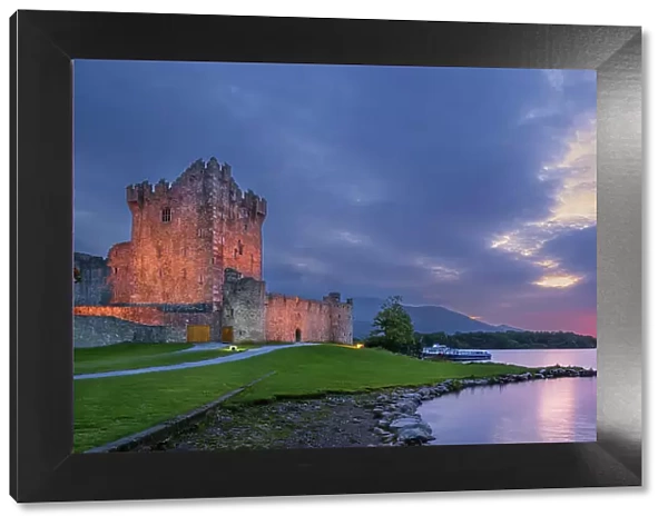 Ross Castle and Lough Leane at dusk, Killarney National Park, County Kerry, Republic of Ireland. September, 2022