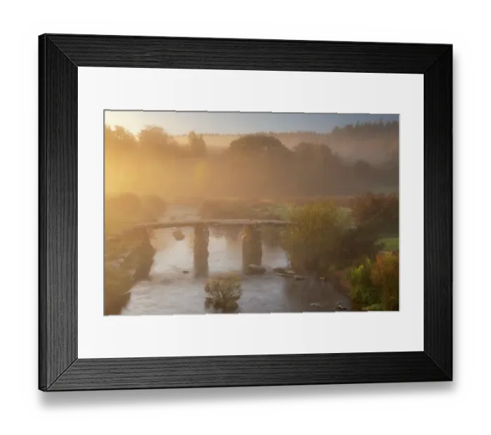 Framed Print : A clapper Bridge across the East Dart river in early morning mist, Dartmoor National Park, Devon, UK. October, 2018 Framed Print : A clapper Bridge across the East Dart river in early morning mist, Dartmoor National Park, Devon, UK. October, 2018
