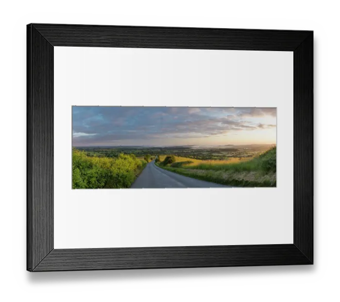 Framed Print : The road to Okeford Fitzpaine; dawn on Midsummers Day, in the Blackmore Vale, from Okeford Hill, Dorset, England, UK. June 2019 Framed Print : The road to Okeford Fitzpaine; dawn on Midsummers Day, in the Blackmore Vale, from Okeford Hill, Dorset, England, UK. June 2019