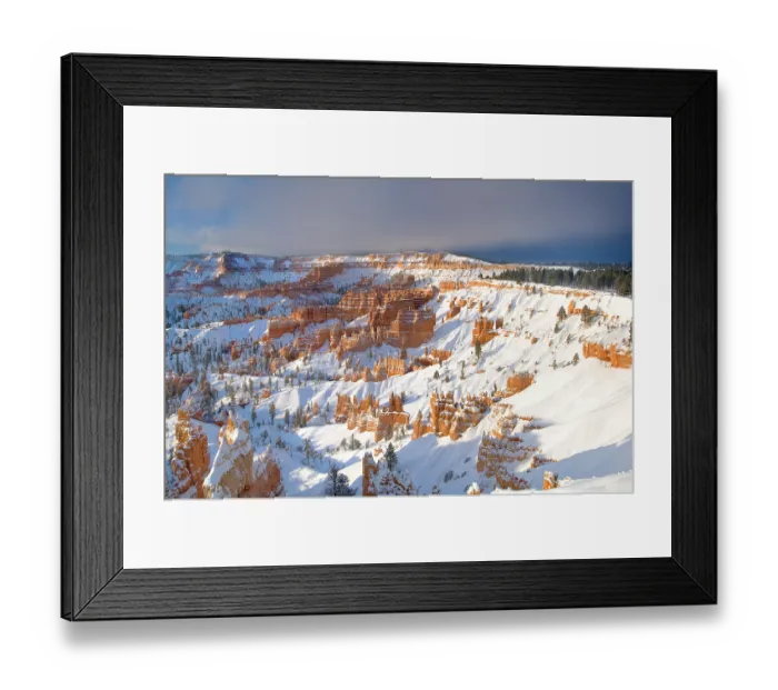 Framed Print : A winter sunrise over snow covered red standstone hoodoos viewed from Sunset Point, Bryce Canyon National Park, Utah, USA. March, 2008 Framed Print : A winter sunrise over snow covered red standstone hoodoos viewed from Sunset Point, Bryce Canyon National Park, Utah, USA. March, 2008