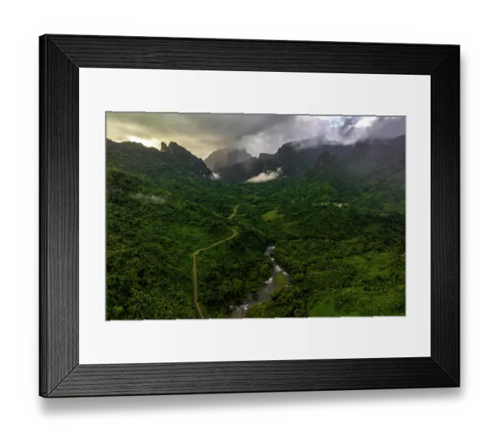 Framed Print : Aerial view of a gravel road leading through a river valley in the lush and mountainous Namosi Province, located in the interior of Fiji's largest island of Viti Levu, Fiji Framed Print : Aerial view of a gravel road leading through a river valley in the lush and mountainous Namosi Province, located in the interior of Fiji's largest island of Viti Levu, Fiji