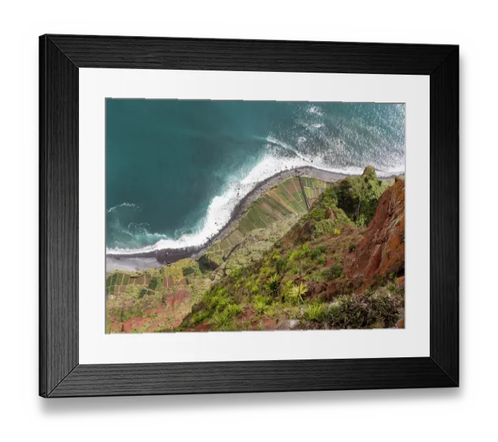 Framed Print : View looking down the steep sea cliffs on to cultivated strips of land along the coast, Cabo Girao, Madeira. March, 2023 Framed Print : View looking down the steep sea cliffs on to cultivated strips of land along the coast, Cabo Girao, Madeira. March, 2023