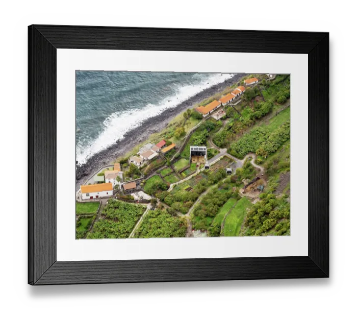 Framed Print : View looking down on cable car on steep coastal cliffs with an organic farm at bottom, Faja dos Padres, Madeira. March, 2023 Framed Print : View looking down on cable car on steep coastal cliffs with an organic farm at bottom, Faja dos Padres, Madeira. March, 2023