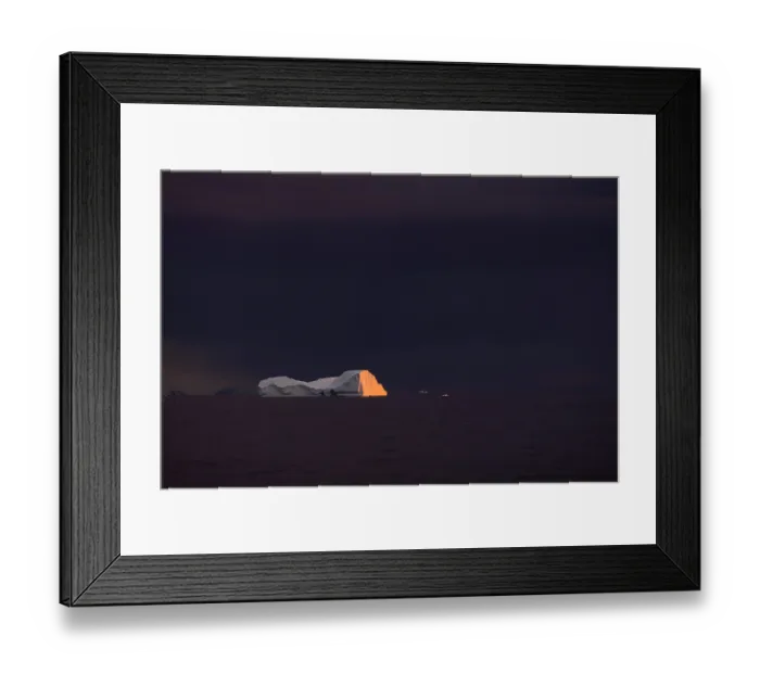 Framed Print : Last light in a stormy evening over an iceberg in Marguerite Bay, Antarctic Peninsula, Antarctica. March, 2023 Framed Print : Last light in a stormy evening over an iceberg in Marguerite Bay, Antarctic Peninsula, Antarctica. March, 2023