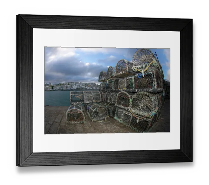 Framed Print : Creel lobster pots stacked on harbour wall, St.Ives, Cornwall, UK. December Framed Print : Creel lobster pots stacked on harbour wall, St.Ives, Cornwall, UK. December