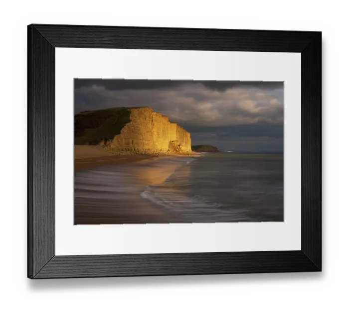 Framed Print : Late evening light bathing sandstone cliffs at West Bay, Jurassic Coast World Heritage Site, Dorset, England, UK. February, 2023 Framed Print : Late evening light bathing sandstone cliffs at West Bay, Jurassic Coast World Heritage Site, Dorset, England, UK. February, 2023