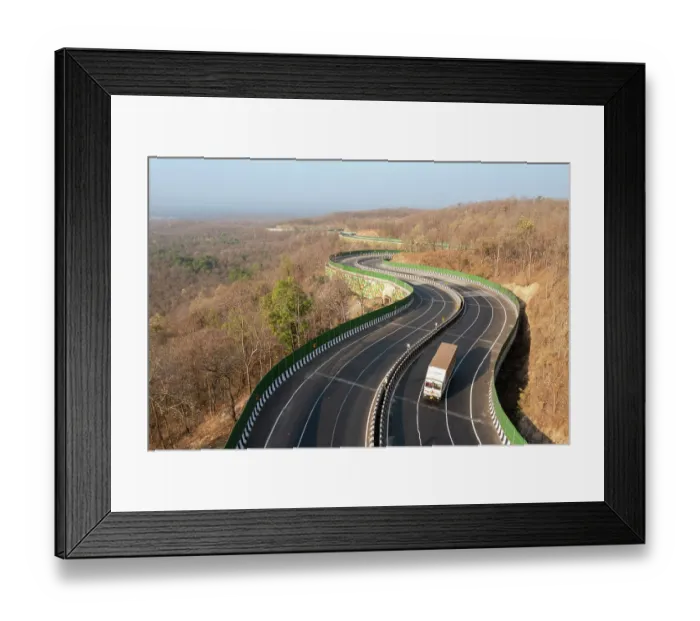 Framed Print : Drone shot of National Highway NH-44, the longest national highway in India, seen here passing through Pench Tiger Reserve, Madhya Pradesh, India Framed Print : Drone shot of National Highway NH-44, the longest national highway in India, seen here passing through Pench Tiger Reserve, Madhya Pradesh, India