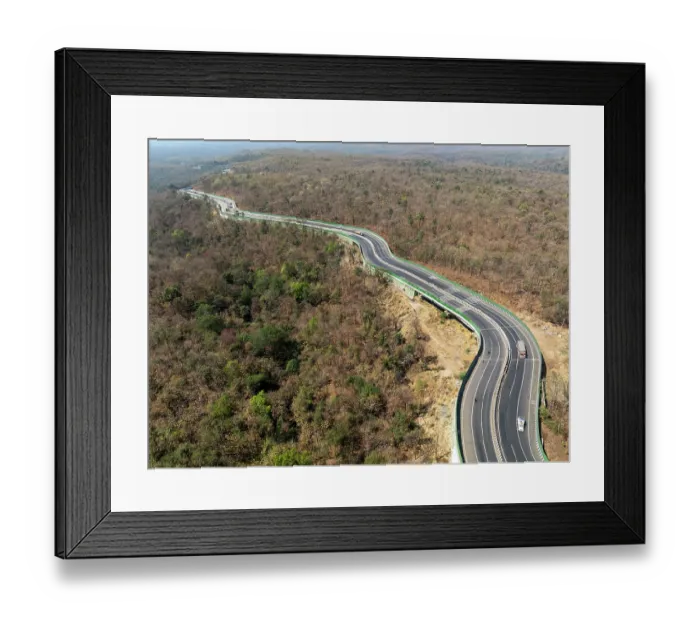Framed Print : Drone shot of National Highway NH-44, the longest national highway in India, seen here passing through Pench Tiger Reserve, Madhya Pradesh, India Framed Print : Drone shot of National Highway NH-44, the longest national highway in India, seen here passing through Pench Tiger Reserve, Madhya Pradesh, India