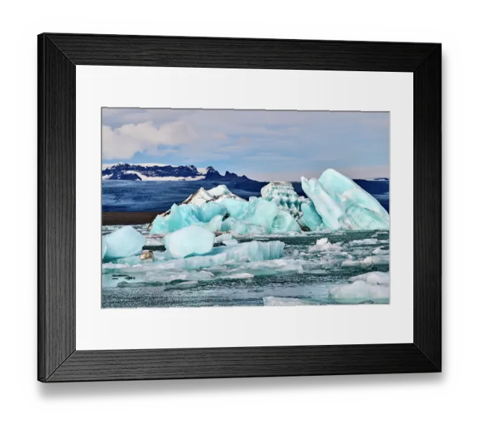 Framed Print : RF - Icebergs in glacial lagoon with glacier in background, Jokulsarlon ice lagoon, Vatnajokull National Park, Iceland. September